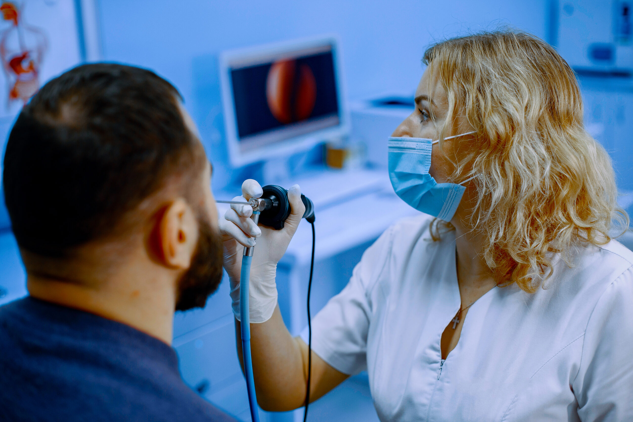 Doctor talking to her male patient at office